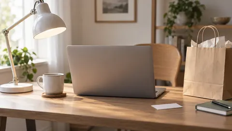 Illustration of a desk lamp, laptop, shopping bag and blank coupon on a desk.